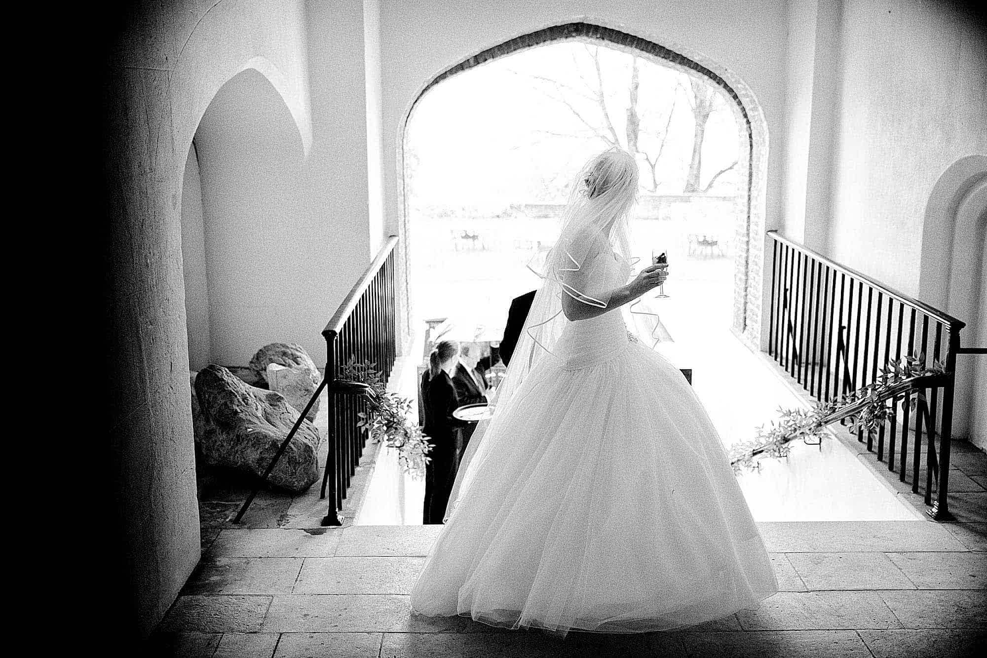 Farnham Castle Wedding Photography - Bride in the Archway at Farnham Castle