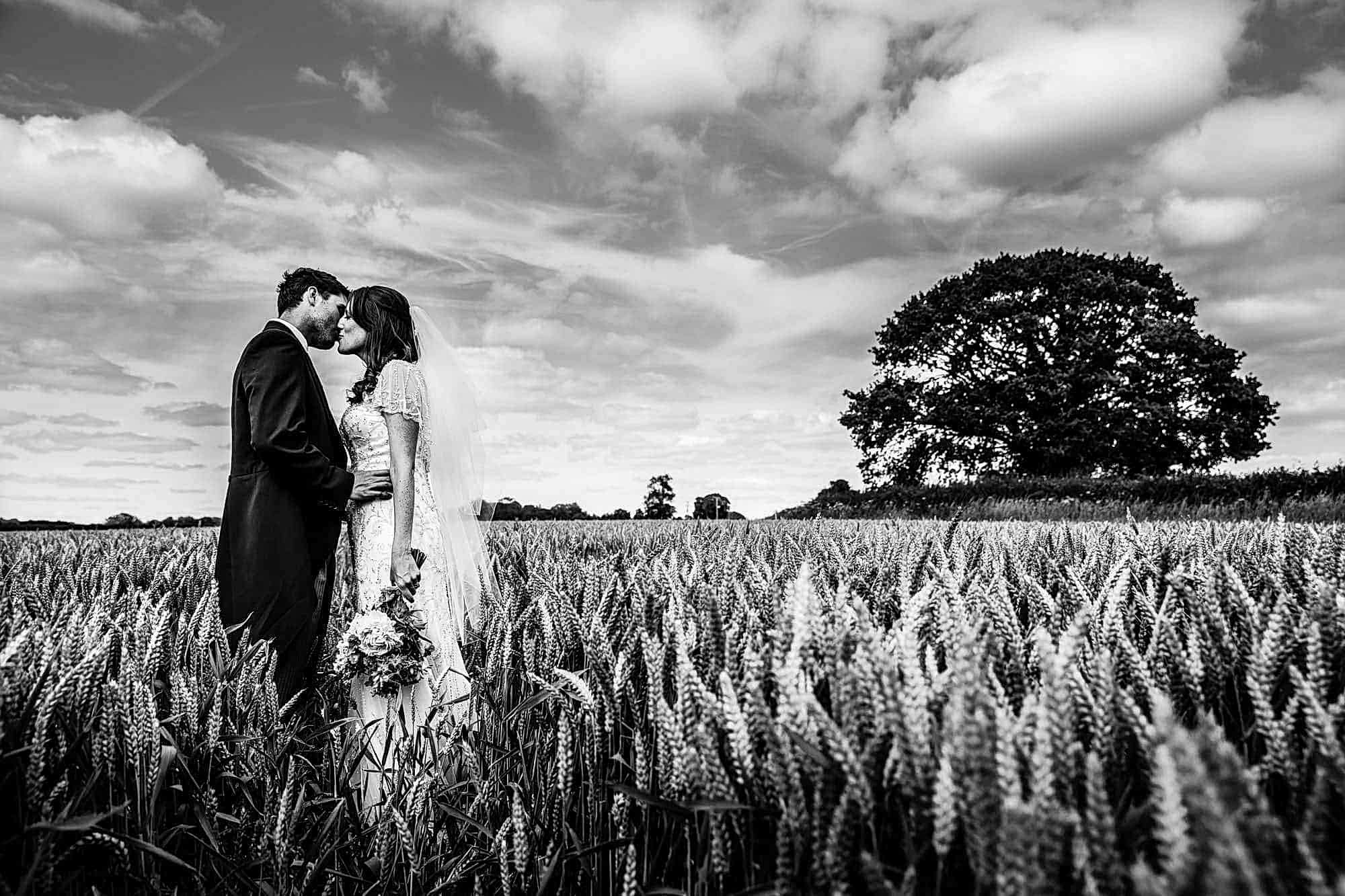 Tipi Wedding Hampshire - Wedding Couple Portraits in Corn Field by Tansley Photography