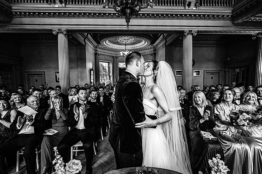 Hampton Court House wedding photography - First Kiss - BW image by Tansley Photography